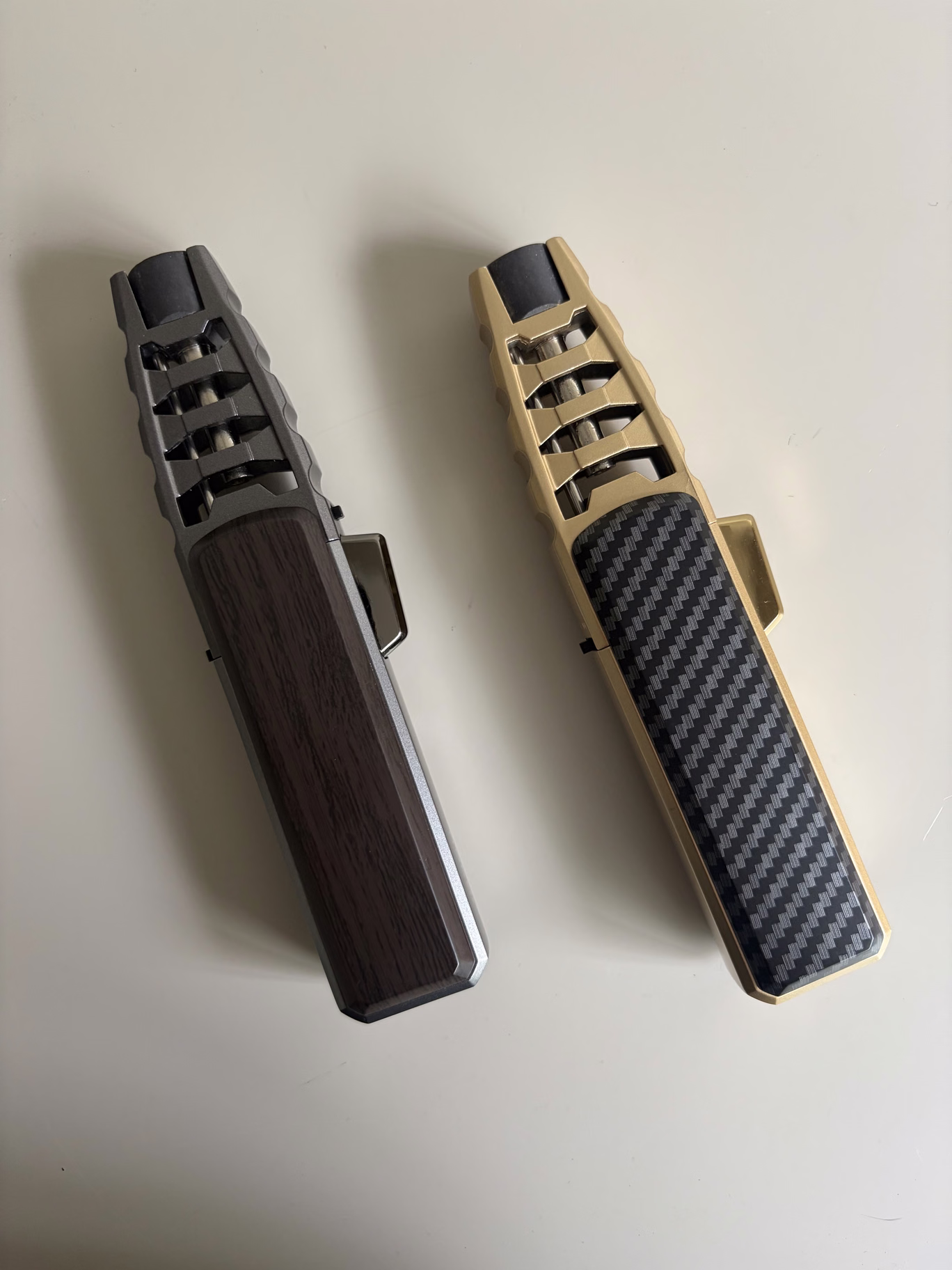 Dark wood-look and gold-coloured carbon-look finishes side by side.